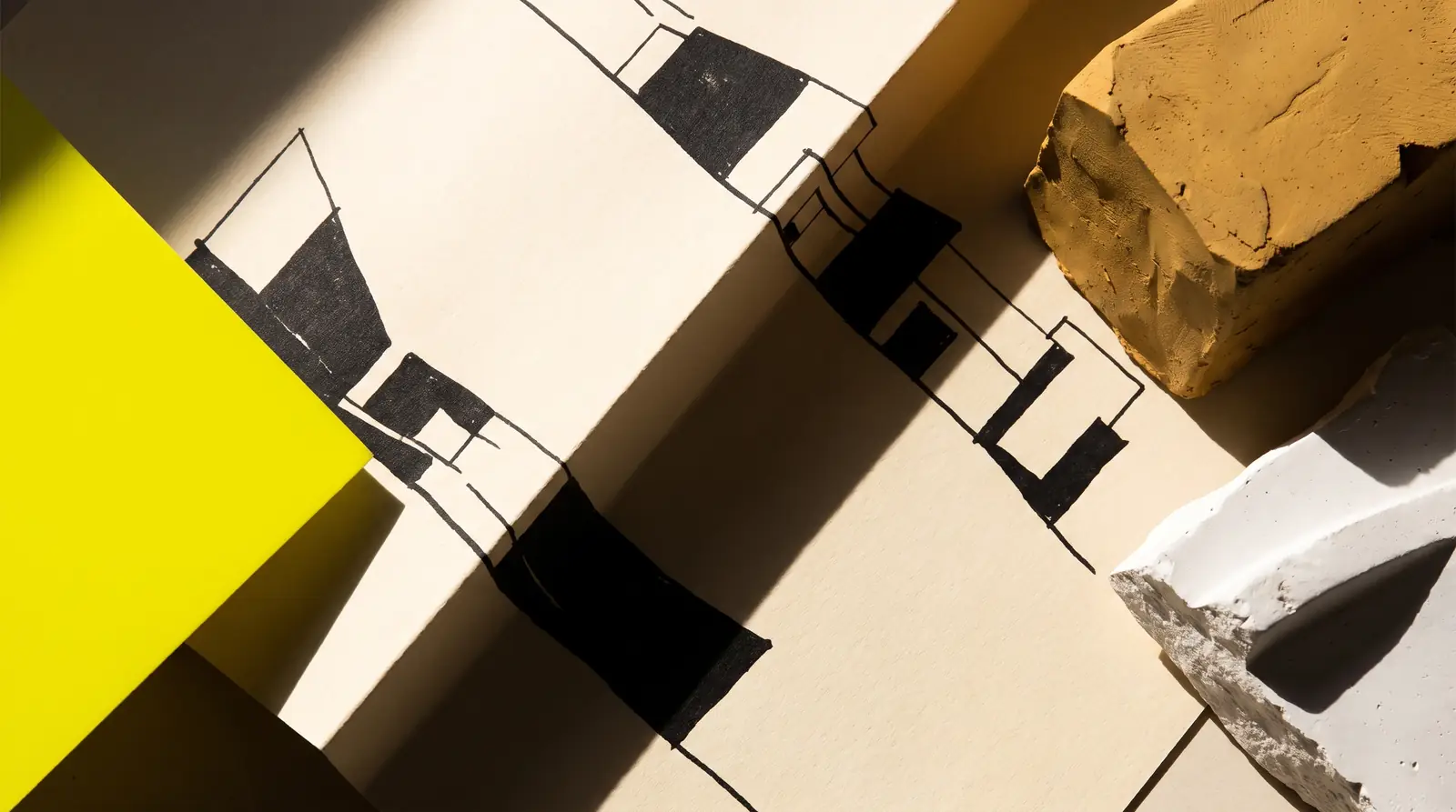 a folded paper plan catching hard light