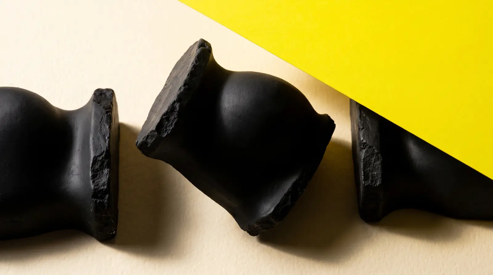 three plaster forms, one out of alignment