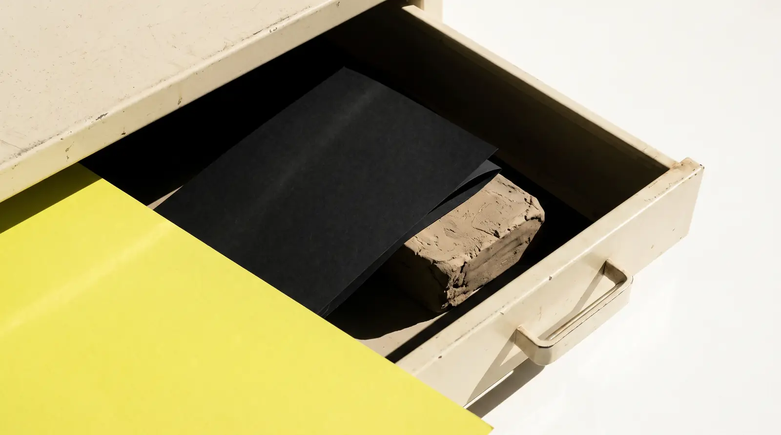 an empty flat file drawer pulled open